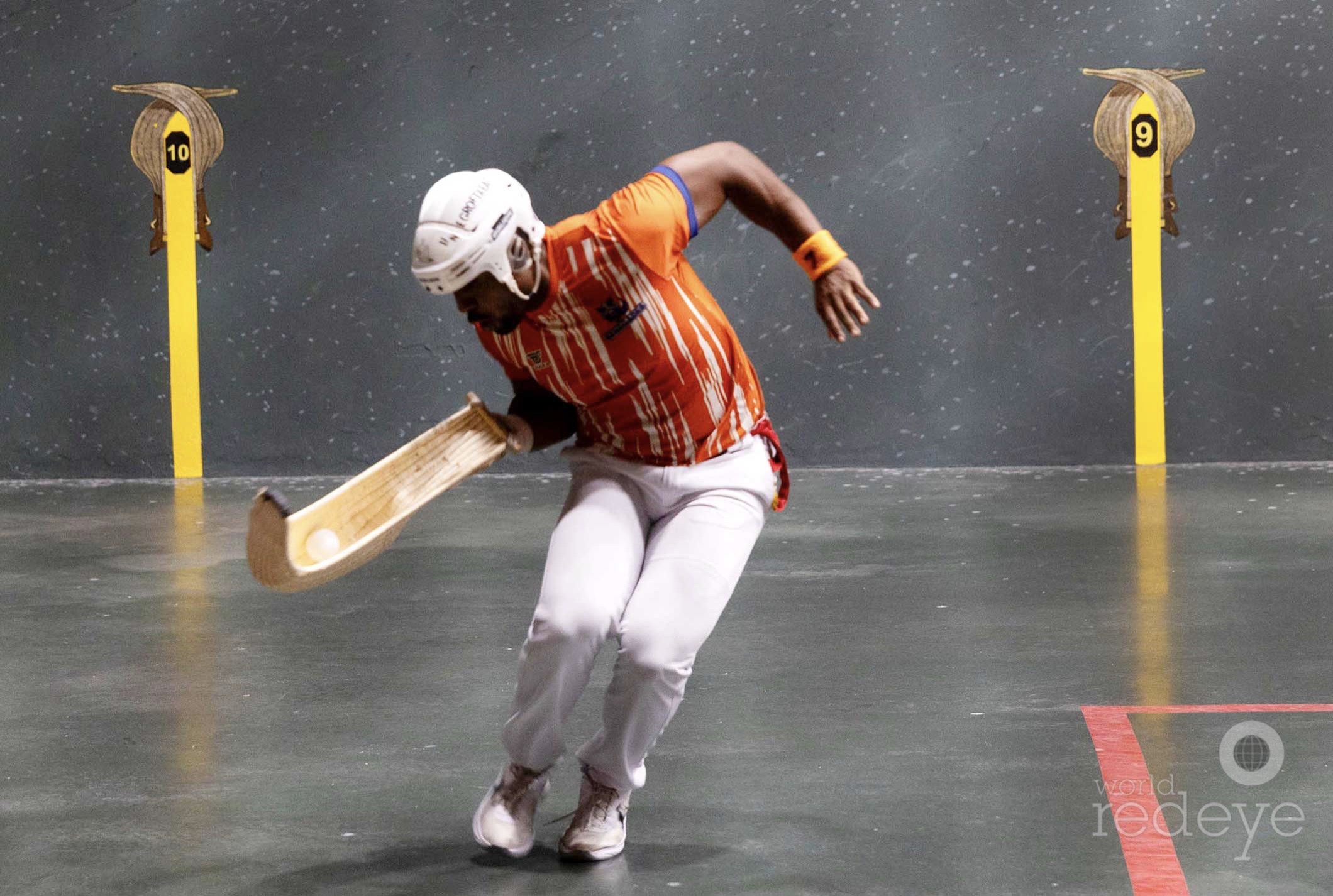 A jai alai player exploding through his final match moment