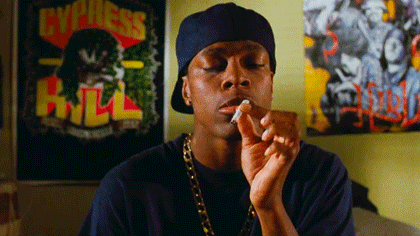 A young man smoking in a comic film moment